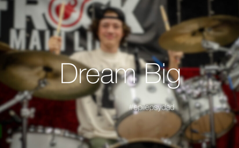 a teenage boy with epilepsy playing the drums